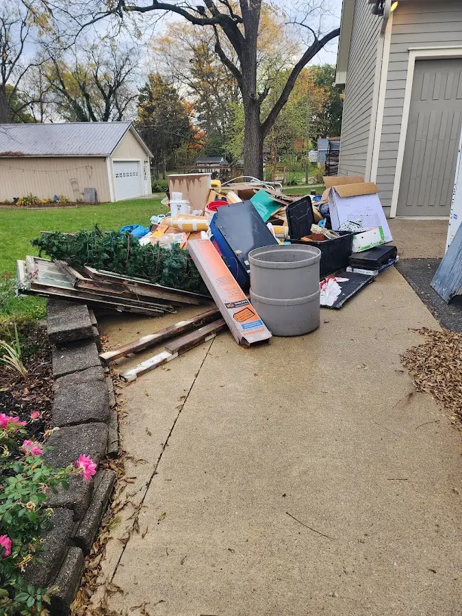 Dumpster being loaded with debris for 30 Yard Dumpster Rental in Hybla Valley